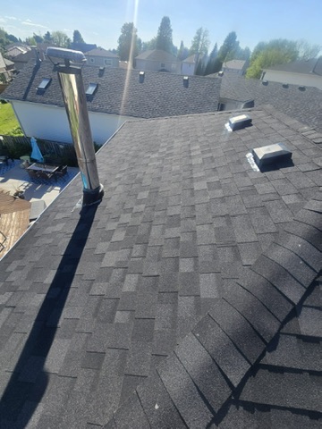Red architectural shingles with rooftop vent detail by 905 Roofing Inc. in Durham Region and the GTA