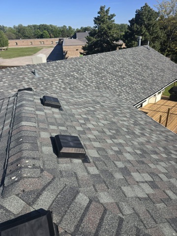 Sloped roof section with vents and pool visible below by 905 Roofing Inc. in Durham Region and the GTA