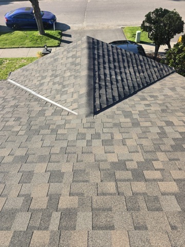 Wide roof view with clean shingle layout and skylight opening by 905 Roofing Inc. in Durham Region and the GTA