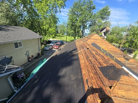 Roof temporarily protected with tarps during installation by 905 Roofing Inc. in Durham Region and the GTA