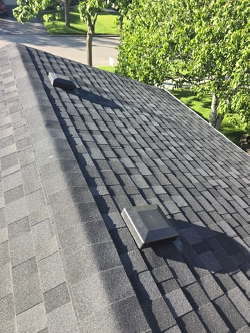 Low-slope roof section with vents and finished shingles by 905 Roofing Inc. in Durham Region and the GTA